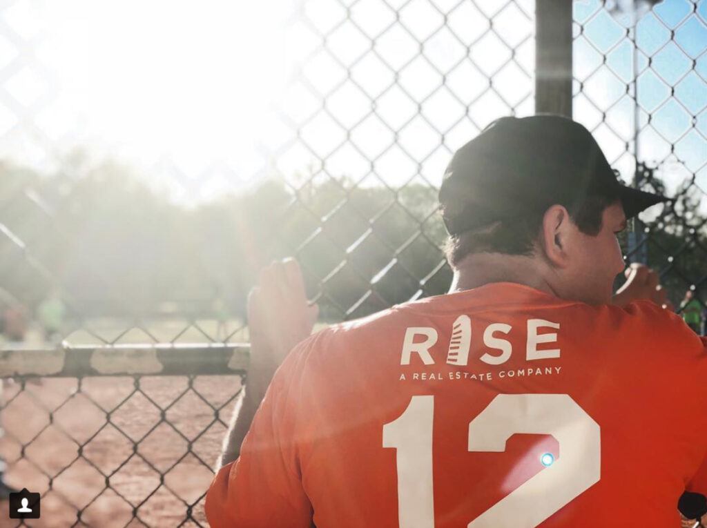 RISE Red Mountain luxury apartments in Birmingham employees playing softball