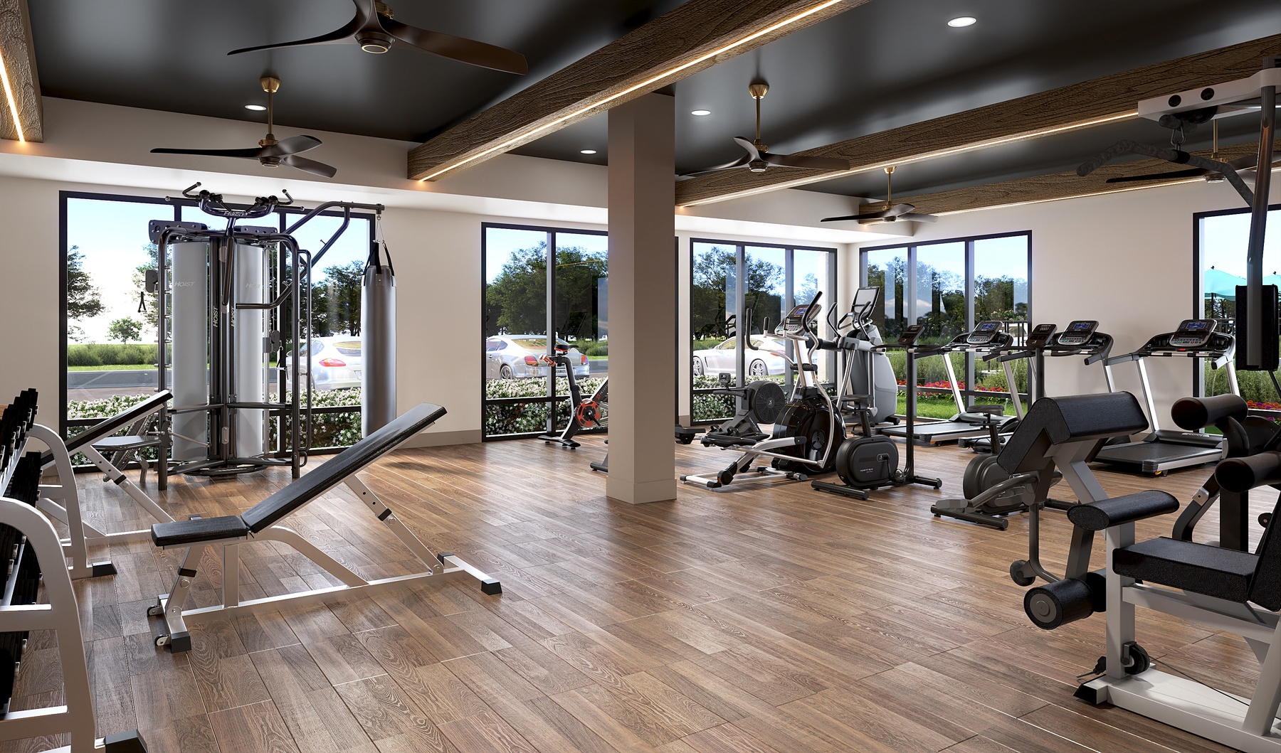 RISE Red Mountain luxury Birmingham apartments fitness center with treadmills, ellipticals, and weight machines